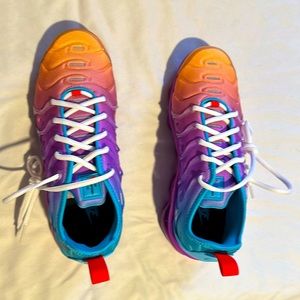 Brand new pair of Nike Vapormax Plus athletic shoes. Comes with original box.